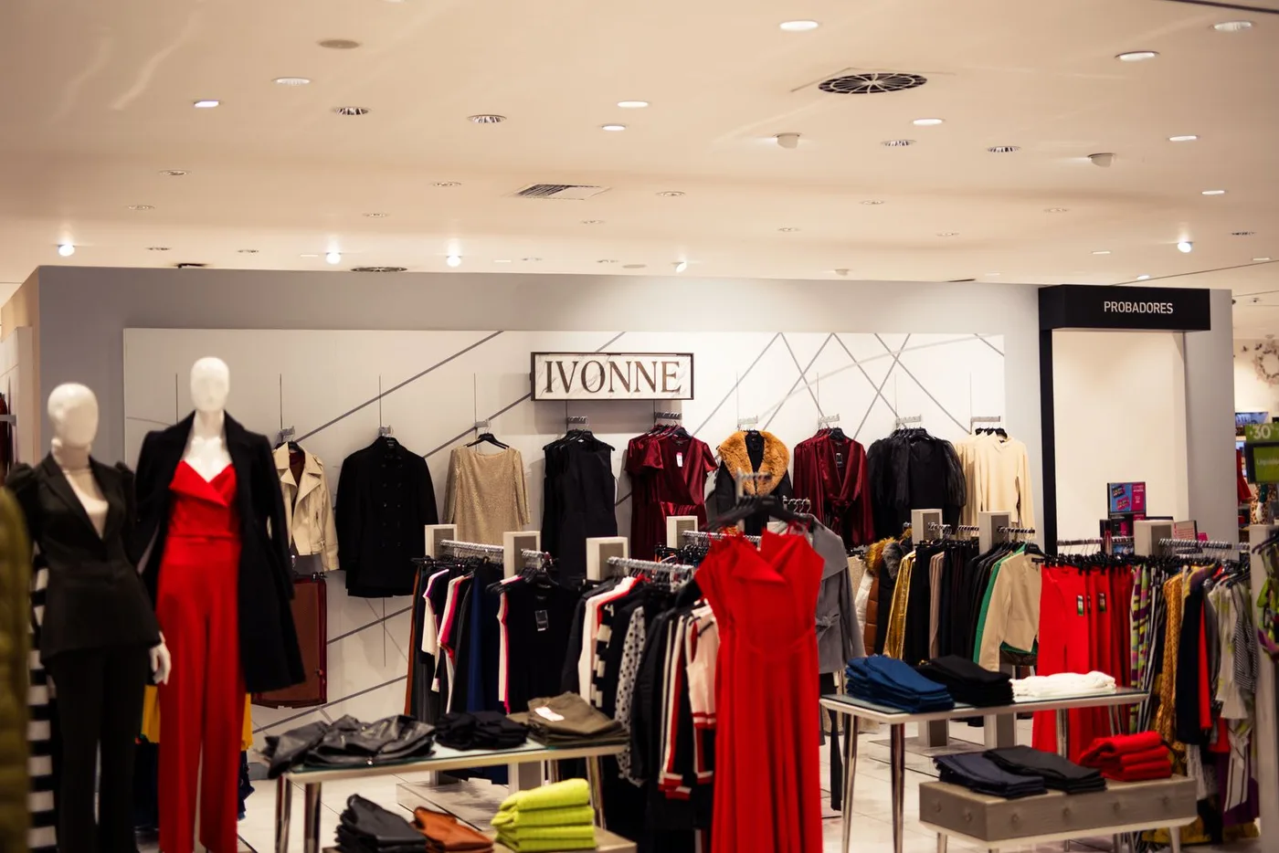 The interior of a clothing shop with racks of garments